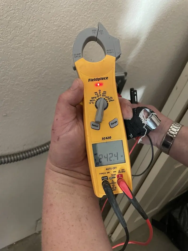 Voltage testing with clamp meter during Outlet Installation in Texas City